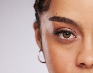 Image showing Eye, vision and beauty with contact lens and black woman, care for eyes and cosmetics with closeup on studio background. Microblading, eyebrow and lashes, face and skin in portrait with mockup space