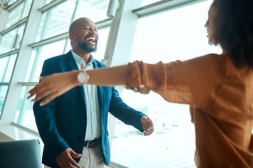 Image showing Happy, love and couple hugging in the airport for reunion with care, happiness and excitement. Travel, greeting and loving young African man and woman embracing with intimacy in a terminal lounge.