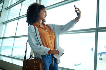 Image showing Travel, phone and selfie with black woman at airport for social media, departure and vacation. Tourism, flight and smile with passenger with passport by window for journey, pictures and holiday