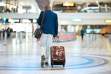 Image showing Suitcase, airport and black man travel for business opportunity, international career and immigration. Professional person or entrepreneur walking from behind with luggage for flight and global job