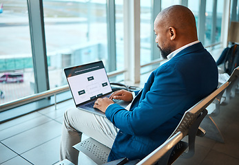 Image showing Travel, laptop and serious with black man in airport for planning, vip lounge and communication. Relax, internet and technology with businessman reading email on layover for vacation, trip and flight