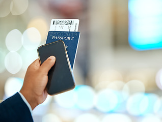 Image showing Airport, passport and ticket in hand with phone for online booking, travel and immigration registration on bokeh. Smartphone screen, mockup and identity document of man or person with flight payment