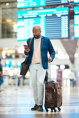 Image showing Black man with phone, luggage and checking flight schedule online, waiting in terminal for international business trip. Internet, travel app and businessman at airport for international destination.