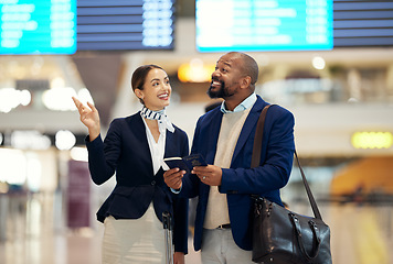 Image showing Businessman, airport and service agent pointing traveler to departure, flight time or information. Black male with female passenger assistant helping in travel directions or FAQ for airline traveling