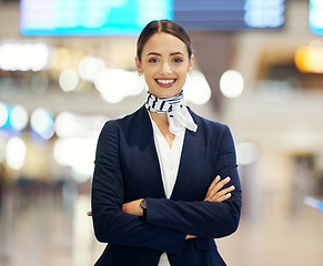 Image showing Woman, airport and passenger assistant with arms crossed standing ready with smile in FAQ, help or direction. Portrait of happy female airline service agent smiling for immigration or travel services