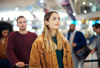 Image showing Travel, queue and wait with woman in airport for vacation, international trip and tourism. Holiday, luggage and customs with passenger in line for airline ticket, departure and flight transportation