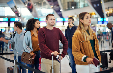 Image showing Travel, queue and wait with man in airport for vacation, international trip and tourism. Holiday, luggage and customs with passenger in line for airline ticket, departure and flight transportation