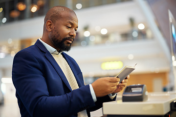 Image showing Black man, reading passport and airport for travel, security and identity for global transportation service. African businessman, documents and concierge for immigration with international transport