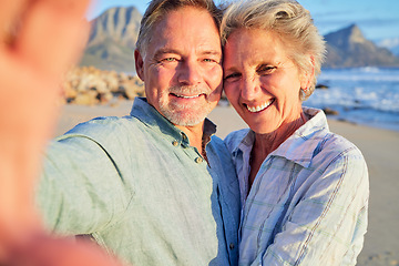 Image showing Selfie, beach and senior couple with summer, holiday or vacation together for social media update. Happy retirement, elderly people or woman love and hug for portrait profile picture at ocean or sea
