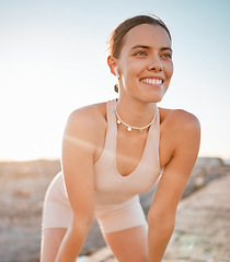 Image showing Fitness break, woman and smile from running exercise, marathon training and outdoor workout. Happy face, female runner and earphones to rest with happiness, breathing and motivation of wellness goals