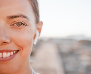 Image showing Half portrait, fitness and music with a sports woman outdoor, standing against a mockup sky background. Face, exercise and wellness with a female athlete cardio or endurance training alone outside