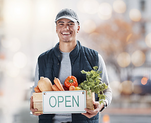 Image showing Vegetables, open sign and man portrait for market, small business and food supplier in agriculture industry. Happy entrepreneur or seller with box of healthy product box on urban street for startup