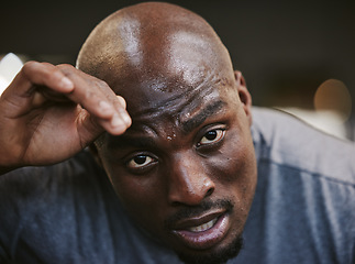 Image showing Fitness, sweat and portrait of tired black man face in sports gym for exercise, workout and health goals. Motivation, sport and relax after intense training, healthy mindset, lifestyle and fatigue.