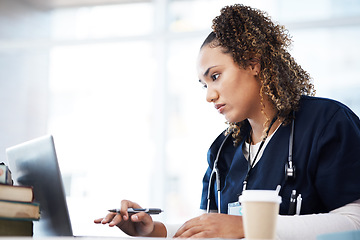 Image showing Healthcare, laptop and insurance with a black woman nurse reading information in a hospital for diagnosis. Medical, research and education with a serious female med student working in a clinic