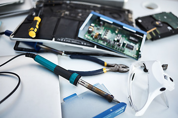 Image showing Tools, computer hardware and equipment in the office for tech repairs, maintenance or upgrade. Database, technology and supplies for electric board servers on a desk in the it industry workplace.