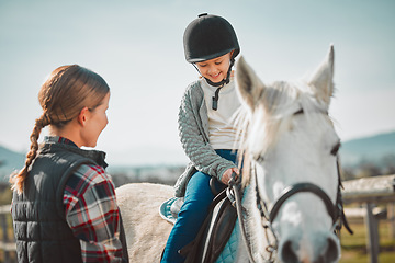 Image showing Learning, hobby and girl on a horse with a woman for fun activity in the countryside of Italy. Happy, animal and teacher teaching a child horseback riding on a field as an equestrian sport in nature