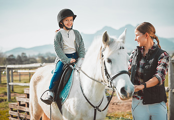 Image showing .Happy child on horse, woman with harness on ranch and mountain in background lady and animal walking on field. Countryside lifestyle, rural nature and farm animals, mom girl kid to ride pony in USA.