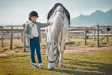 Image showing .Smile, portrait and horse with of girl on countryside for riding, equestrian and affectionate. Pet, pasture and stallion with child jockey and animal on nature ranch for relax, travel or weekend.