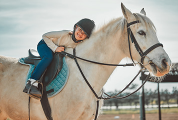 Image showing .Horse riding, young equestrian and portrait of a girl on a animal in the countryside. Farm, summer and horses training outdoor on farming field with a happy kid smile learning to ride for sport.