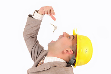 Image showing A businessman engulf keys 