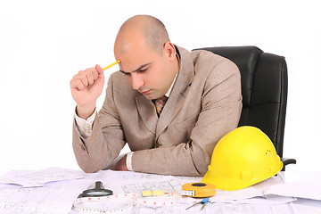 Image showing Businessman thinking with architectural plans