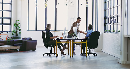 Image showing Business meeting, b2b and handshake in office for planning and strategy project discussion at design agency. Corporate people, partnership and designer team with client for creative vision and ideas.