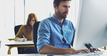 Image showing Focus, computer or man in office for cybersecurity, app coding or networking. Programmer, developer or employee typing on tech for software code, programming or startup SEO website schedule review