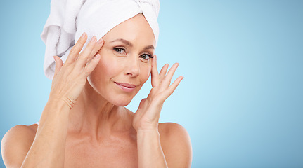 Image showing Skincare, portrait and senior woman isolated on a blue background for beauty, cosmetics and anti aging mockup. Mature model or person makeup foundation, dermatology and hygiene wellness in studio