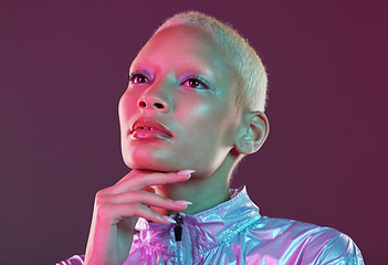 Image showing Vaporwave style, black woman and cyberpunk aesthetic with model thinking in a studio. Isolated, glow makeup and futuristic cyber fashion of a young person with chrome clothing and scifi design