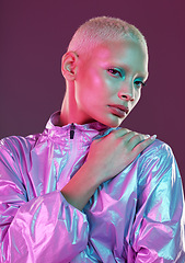 Image showing Cyberpunk, model and portrait of high fashion woman with unique style, makeup and hairstyle isolated in a studio neon background. Creative, artistic and colorful female is trendy and stylish