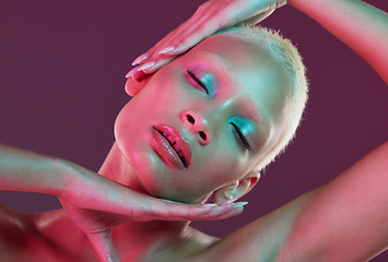 Image showing Cyberpunk, neon beauty and woman with eyes closed, makeup and lights in creative advertising on studio background. Art, aesthetic product placement and model isolated in futuristic skincare mock up.