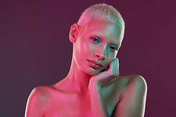 Image showing Skincare, neon face and portrait of woman with makeup and lights for creative advertising on studio background. Cyberpunk, gen z girl and model isolated for beauty and futuristic mock up space