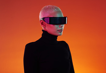 Image showing Woman, vr glasses and metaverse for augmented reality, digital transformation and future tech. Cyberpunk person on orange background with ar software headset for 3d and cyber world user experience