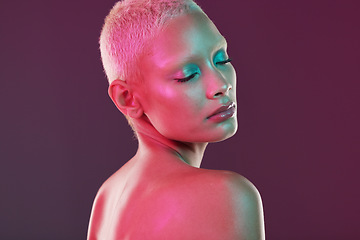 Image showing Skincare, cosmetics and woman with neon makeup and lights for creative advertising on studio background. Cyberpunk, product placement and model isolated for and futuristic beauty and art mockup space