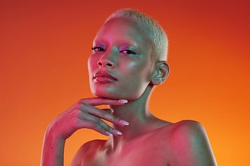 Image showing Cyberpunk, neon beauty and portrait of woman with makeup and light in creative advertising on orange background. Art, product placement and model isolated for skincare and futuristic mockup in studio