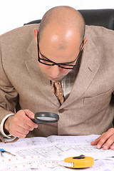 Image showing Businessman with architectural plans 