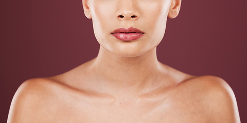 Image showing Face lips, makeup and beauty of woman in studio isolated on a red background. Skincare dermatology, lipstick cosmetics and female model with beautiful, glowing or healthy skin after mouth treatment.