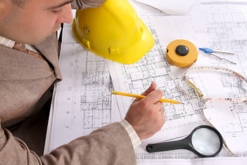 Image showing Businessman with architectural plans 