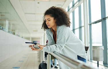 Image showing Ticket, airport and passport of black woman for travel, global opportunity and transport time or schedule. UK person with smartphone and identity document in lobby for flight services and immigration