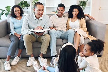 Image showing Senior family, children and reading book for learning, teaching and bible knowledge, spiritual development or education. Grandparents, mother and father on sofa and kids listening to holy scripture