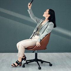 Image showing Selfie, video call and woman with a phone for connection, internet and communication at work on a chair. Corporate and Asian employee reading an email, message or chat on a mobile app in an office