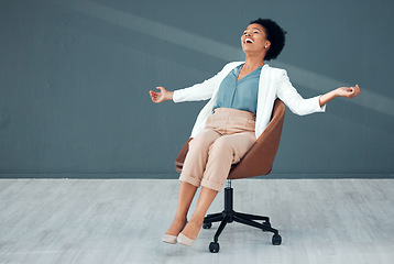 Image showing Chair, carefree and mockup with a business black woman sliding on the floor of her office feeling stress free. Freedom, relax and success with a crazy female employee riding a seat in the workplace