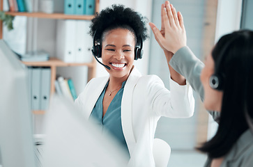 Image showing Success, teamwork and high five with black woman in call center for customer support, contact us and communication. Winner, goals and target with people in office for deal, consulting and help desk