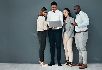 Image showing Business people, group and laptop in office with coach for learning, proposal and together by wall background. Young executive team, diversity and mentor with men, women and computer for coaching