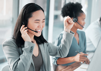 Image showing Call center, success and asian woman at computer in office for customer service, telemarketing and deal. Happy, target and contact us with consultant for technical support, advisory and winner