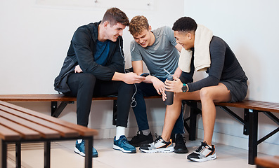 Image showing Fitness, phone and friends in gym locker room after practice, exercise and training together. Team, sports club and men on smartphone for social media, listening to music and relax from workout