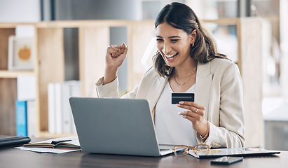 Image showing Finance, credit card and success with woman and laptop in office for savings, investment or online shopping sale. Winner, fintech and ecommerce with customer and website for deal, payment or offer