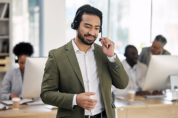 Image showing Call center, smile and consulting with man in office for customer support, telemarketing and advisory. Help desk, team leader and contact us with employee listening for communication, sales and crm