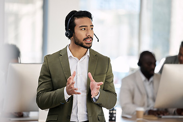 Image showing Call center, serious and consulting with man in office for customer support, telemarketing and advisory. Help desk, team leader and contact us with employee listening for communication, sales and crm