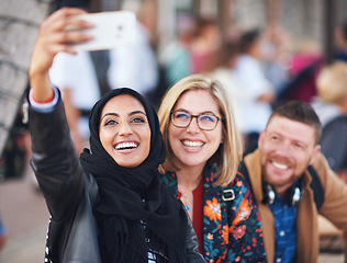 Image showing Friends selfie, muslim woman and city with smile, man and happiness with smartphone on social media. Young gen z people, phone and profile picture for urban adventure in metro for outdoor photography